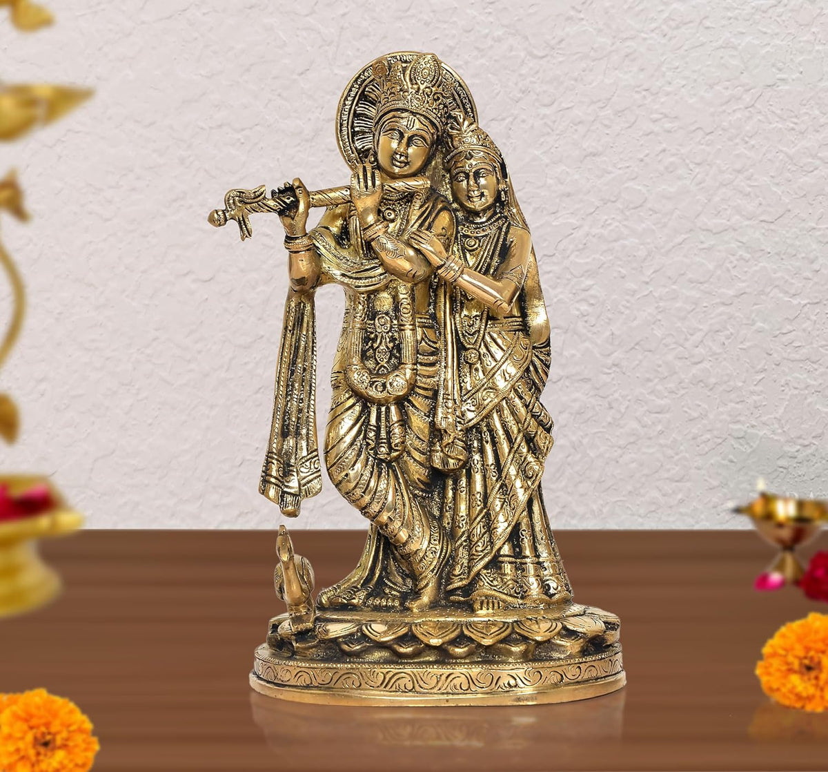 Brass Radha-Krishna idol statue with cow, detailed jewelry and ornate base