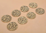 Set of 8 brass Ashtalakshmi wall hangings, oval relief plaques arranged in a cluster