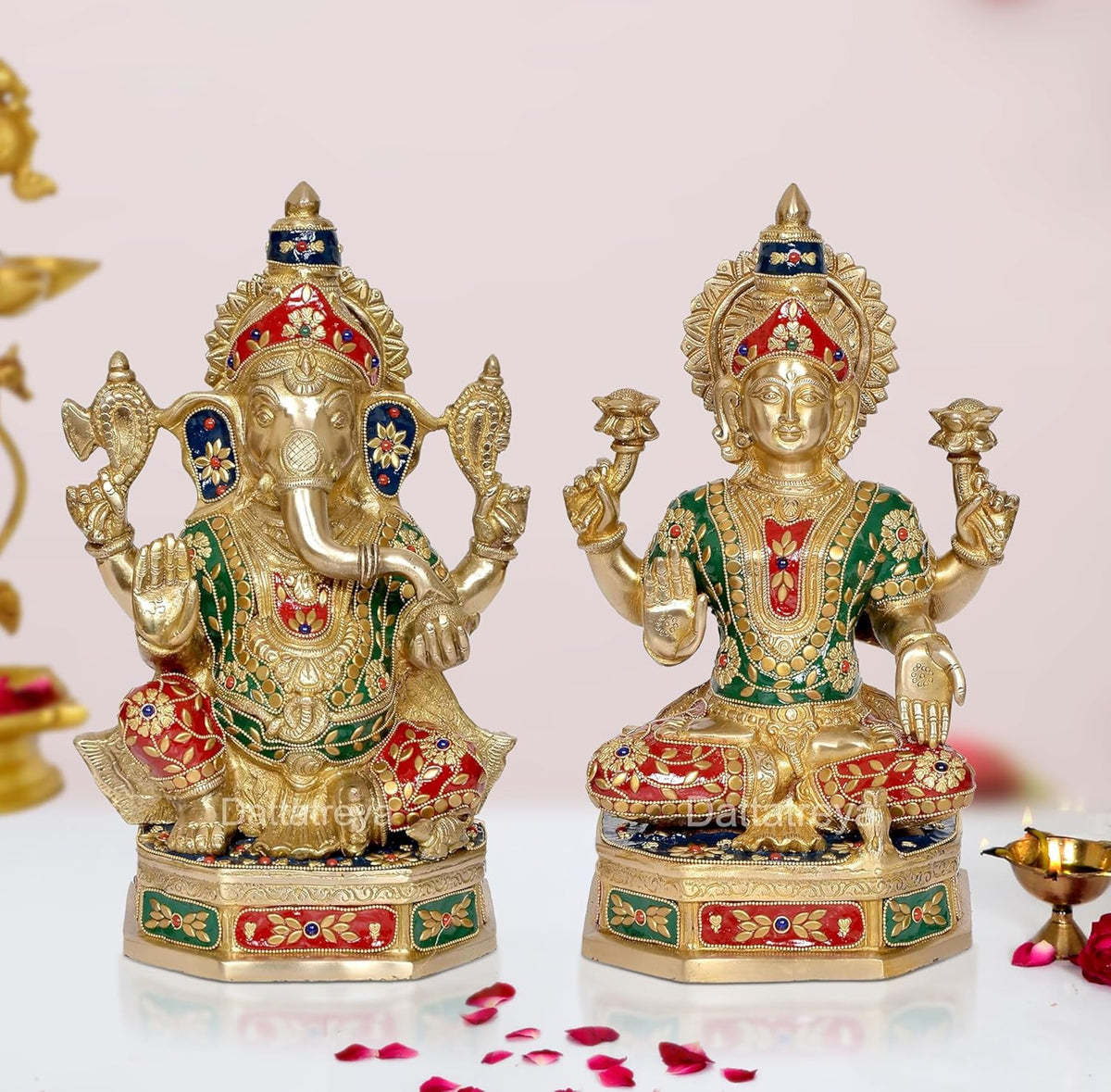 Brass Lakshmi Ganesh statue, seated figures with red-and-green painted details