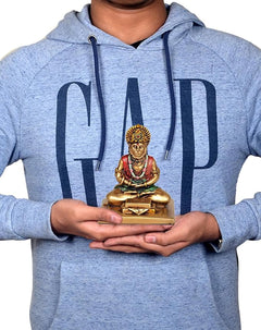 Hanuman JI resin statue held in hands, seated deity with red robe and green accents