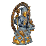 Rear 3/4 view Shiva figurine: dark blue body with gold highlights and tall arch frame
