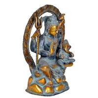 Rear 3/4 view Shiva figurine: dark blue body with gold highlights and tall arch frame