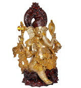 Side view of brass Lord Ganesha idol statue, gold details and dark red crown arch