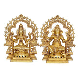 AONA brass pair: Lakshmi seated with raised arms, Ganesha seated in frame