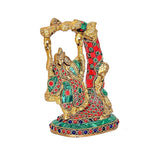 Side view of Radha Krishna Jhula statue, multicolor brass with red dress and green accents