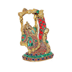 Side view of Radha Krishna Jhula statue, multicolor brass with red dress and green accents