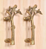 Brass parrot tree door handle pair with detailed branch and leaf motifs, curved bases