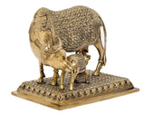 Brass cow with calf statue, back/side view, floral etched body and textured ground base