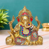 Brass Ganesha idol with colorful stonework, seated with raised hands and jeweled crown