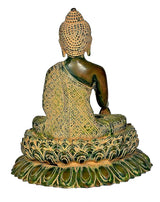 Back view of brass Buddha statue, seated on green lotus base with gold robe pattern