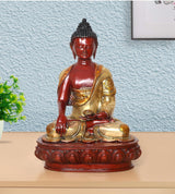 18-inch Buddha statue with red face, gold robe, seated hands in meditation on round base