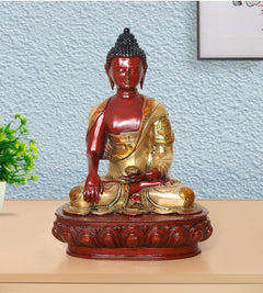 18-inch Buddha statue with red face, gold robe, seated hands in meditation on round base