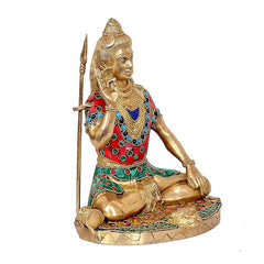Brass Lord Shiva angled statue, trident in left hand; detailed blue, red, green jewelry