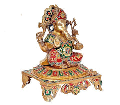 Ganesha brass idol statue angled view with colorful patterns on clothing and base