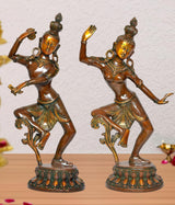 Brass dancing Shiva and Parvati idols with raised hands and ornate jewelry, on round base