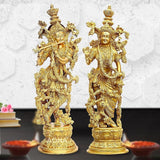 Brass Radha Krishna idol statues, side view of two standing figures with halos