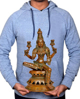 Person holding 12 inch Lakshmi statue, brass-tone seated yoga pose with four lamp holders