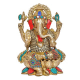 Brass Ganesha statue front view with blue crown, red and turquoise accents, beaded chest