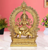 Brass Durga maa idol with multi-armed goddess seated on lion, ornate halo frame