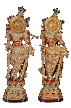 Back view of Radha Krishna brass figurines, detailed carved motifs, brown
