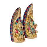 Brass Ganesh and Lakshmi idol, angled view of two figures, enamel inlays, 7.5 in