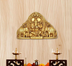 Brass Gaja Ganesha idol with elephants, front view on pedestal