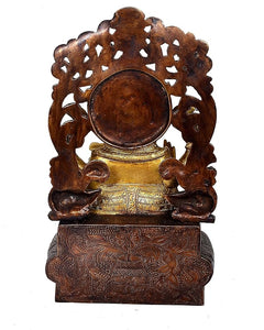 Back view Ganpati statue, carved dark support with round medallion base