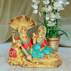 Brass Vishnu and Lakshmi idol on Shesha Naga, seated on serpent, multicolored