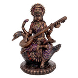 Large Saraswati idol in bronze tone with multicolour details, holding veena
