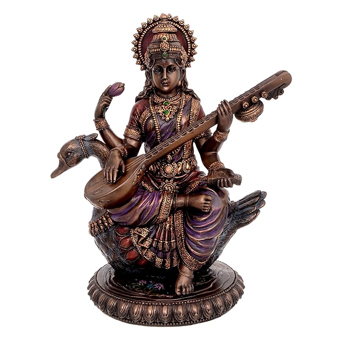 Large Saraswati idol in bronze tone with multicolour details, holding veena