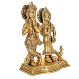 Brass Radha Krishna murti with peacock detail at base, standing figures
