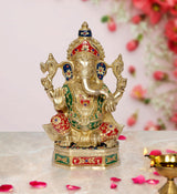 Brass Lord Ganesha statue with multicolor jewel detailing, raised hands, on pedestal base