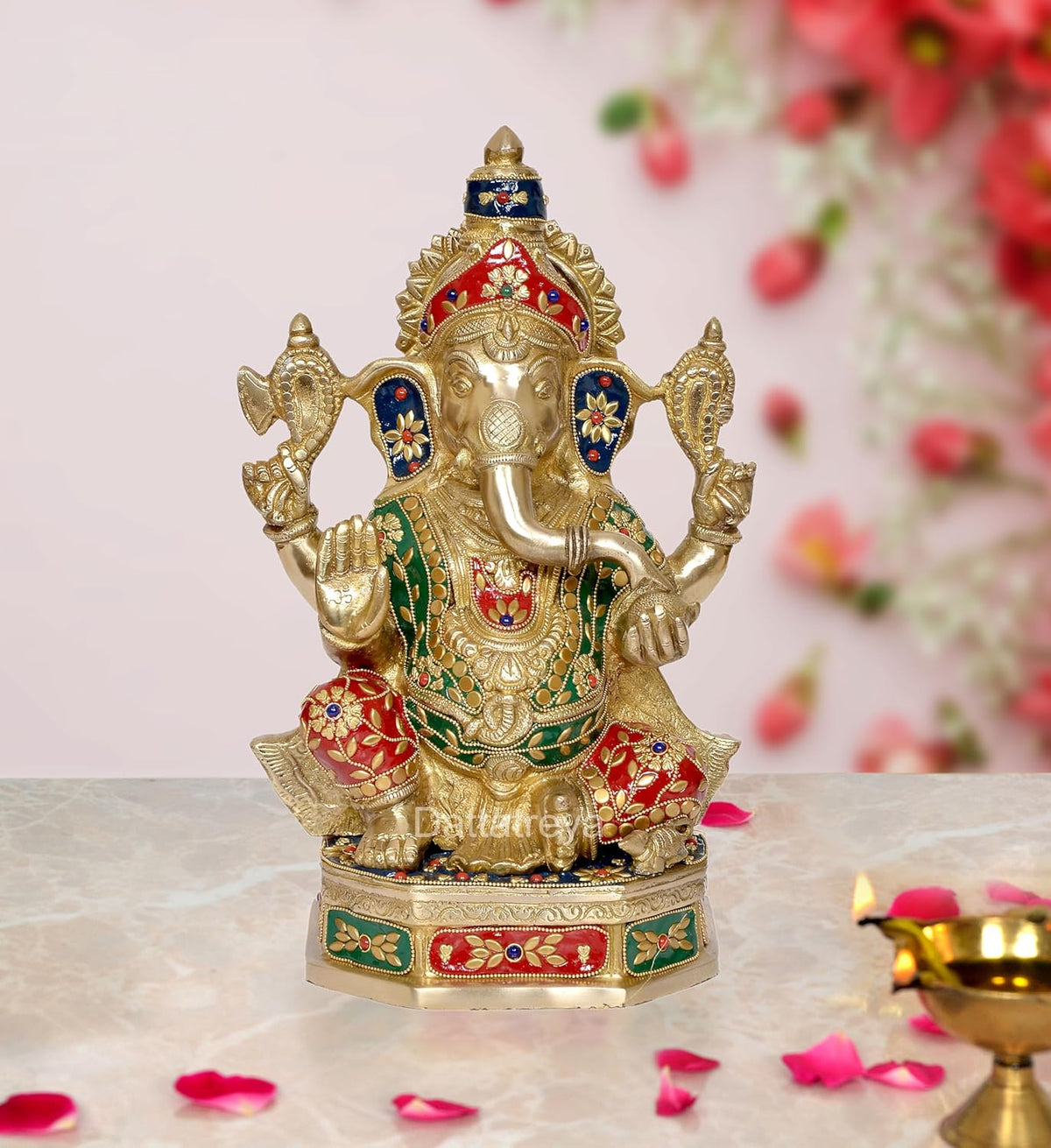 Brass Lord Ganesha statue with multicolor jewel detailing, raised hands, on pedestal base