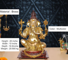 Brass Ganpati Bappa idol, gold-toned with red crown and multicolor accents on pedestal
