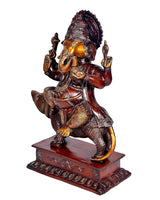 Side view brass Ganesha sitting on mouse figurine, maroon pedestal base