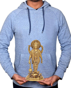 Brass Vishnu statue held in hands on grey hoodie