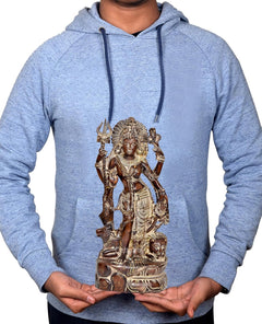 Brass Ardhnariishwar statue held by hands on light gray hoodie
