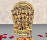Golden brass Vishnu Dasavatara idol with ornate arch behind, seated central figure