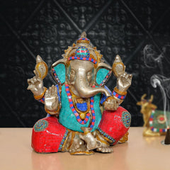 Brass handcrafted Ganpati Bappa murti in red, teal and gold with jeweled headpiece