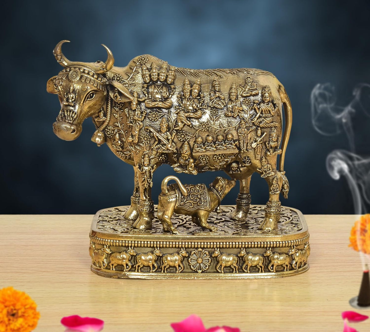 Bronze-finish Kamdhenu cow murti with calf on ornate pedestal base, 4 inch height