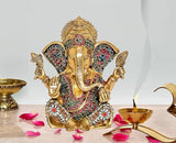 Golden brass Ganesha idol statue, seated with four arms and jeweled crown