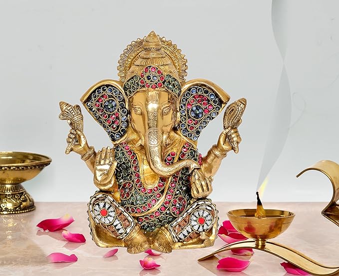 Golden brass Ganesha idol statue, seated with four arms and jeweled crown