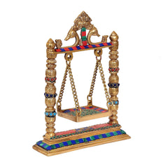 Brass swing for Ladoo Gopal idol, angled view; gold top figure and multicolour base