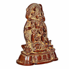 Brass Kali idol three-quarter view, seated goddess with layered ornaments
