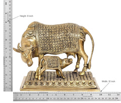 Brass cow with calf statue, height 8 in, floral etched details, on textured platform