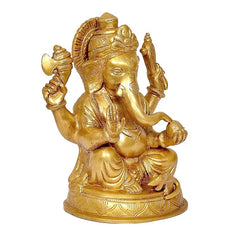 Brass Ganesha idol statue, angled view of seated figure with four arms, round base