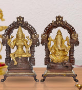 Brass Lakshmi and Ganesha idol pair with ornate arch, golden figures on dark base