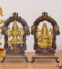 Brass Lakshmi and Ganesha idol pair with ornate arch, golden figures on dark base