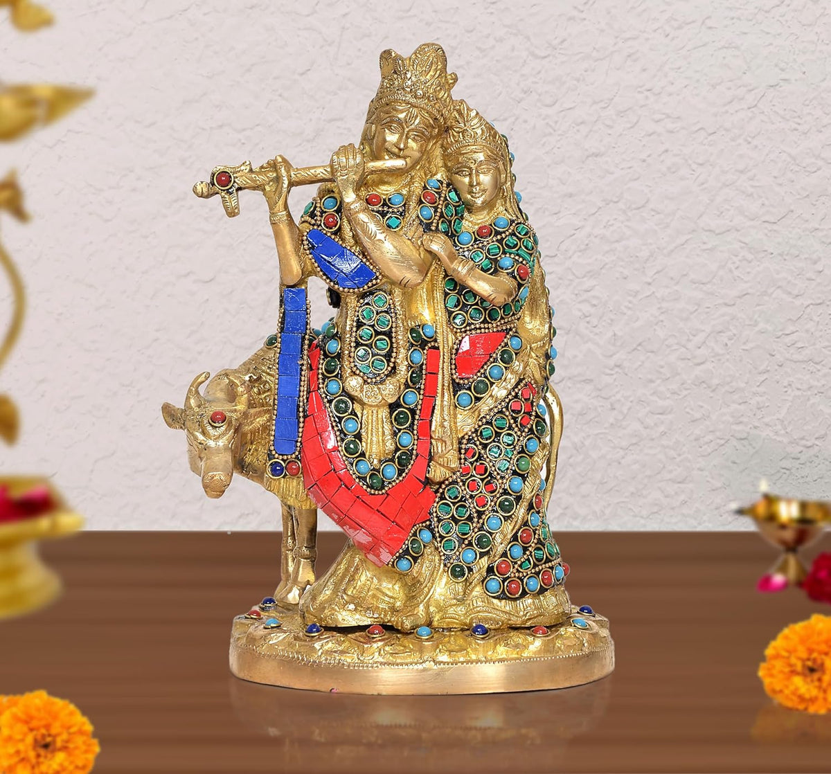 Radha-Krishna brass cow idol statue, blue-red attire with turquoise jewel work