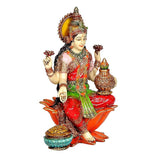 Lakshmi figurine holding a small pot, red sari with green stripe, seated on orange lotus